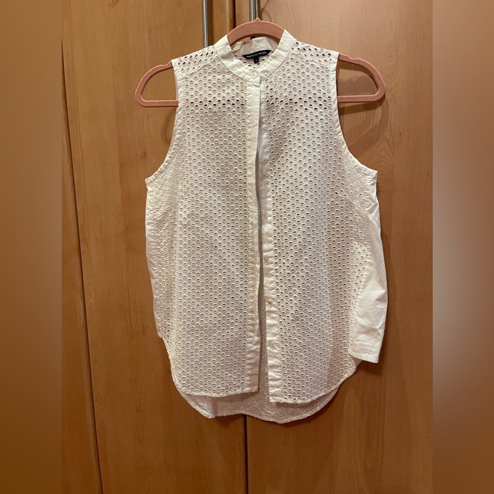 White eyelet sleeveless blouse tunic style